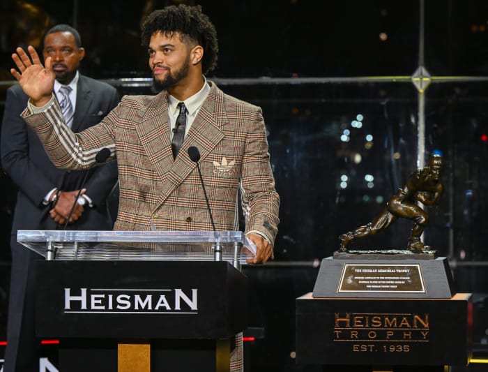 Caleb Williams reacts after winning the Heisman Trophy.